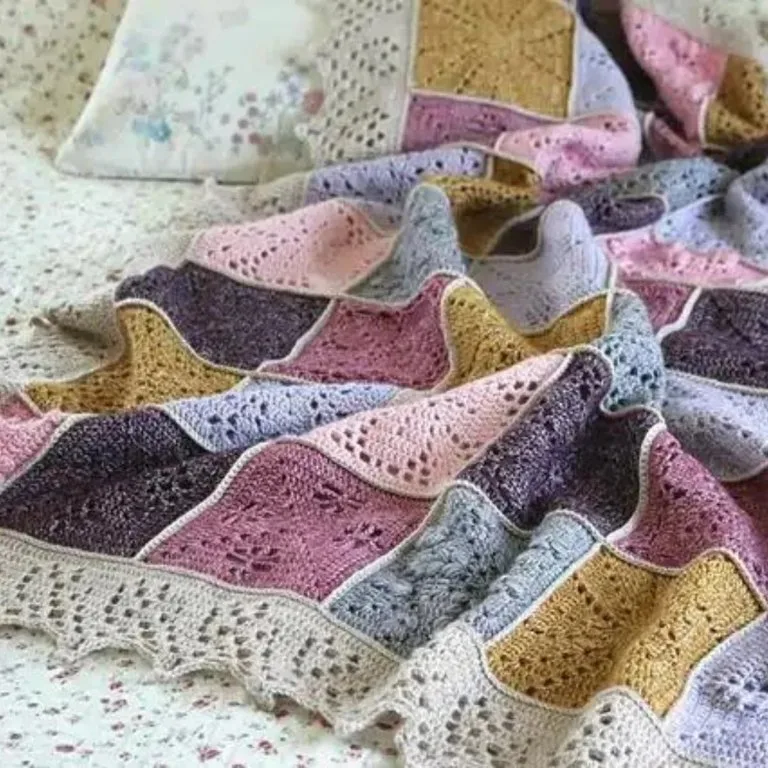 A lightweight crochet granny square blanket, perfect as a gift for both home and her.