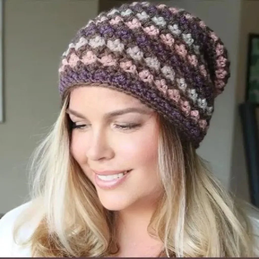 A women wearing a colorful slouchy hat.