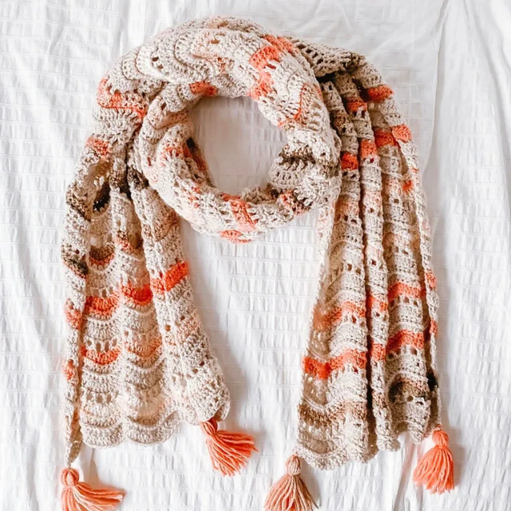 A striped ripple crochet scarf – a perfect project for stash-busting and turning leftover yarn into a cozy, colorful accessory!