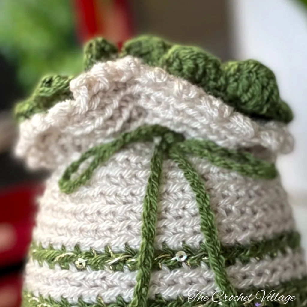 The scalloped edging at the top of a Crochet Gift Bag.
