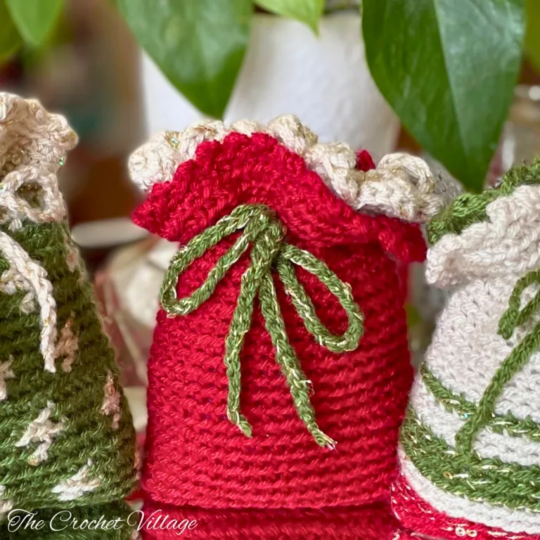 A small crochet gift bag made with the Noel gift bag free crochet pattern