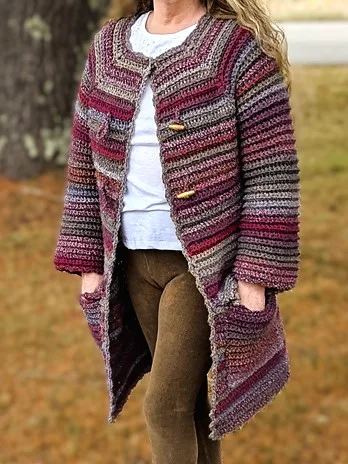 A plus size women wearing a winter top down crochet cardigan that fit's her beautifully