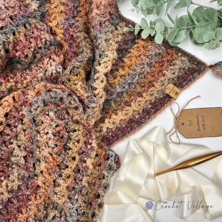 Free crochet waffle V stitch blanket pattern in variegated fall yarn