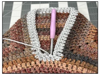 Close-up of joining collar ends in crochet sweater - step-by-step 2tutorial
