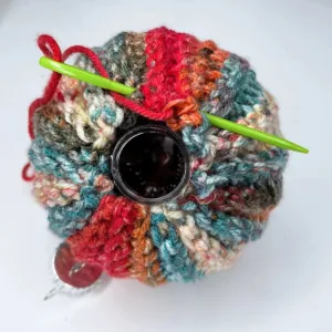 Sewing a crochet piece around a bobble ornament