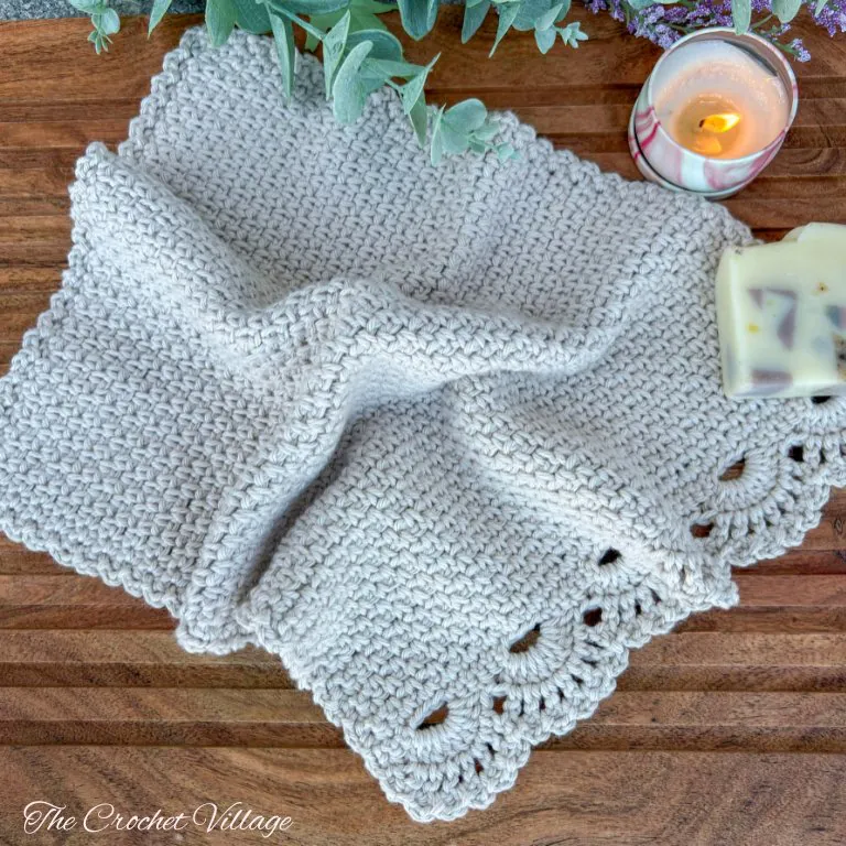 Soft cotton crochet towel featuring elegant lacy border from Ambrosia pattern