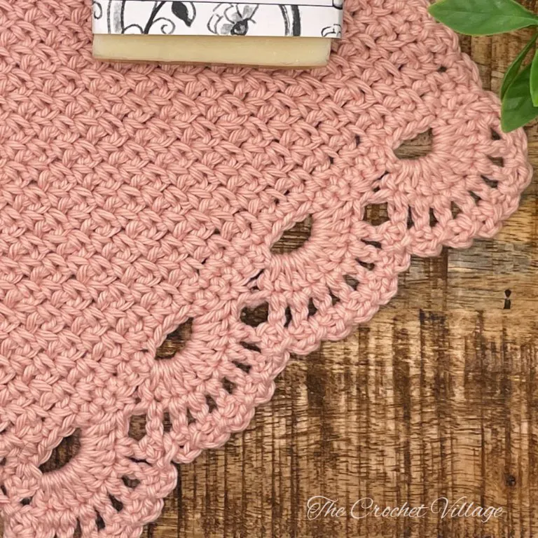 Close up of delicate lacy border detail on Ambrosia crochet washcloth pattern