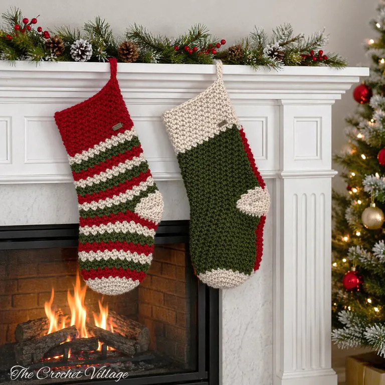 Collection of handmade classic crochet stockings in red, cream, and green colors arranged on a holiday fireplace
