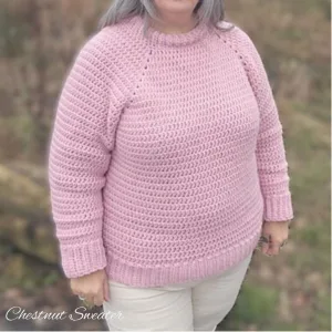 A plus-size woman wearing a simple crochet winter sweater that fits her beautifully.