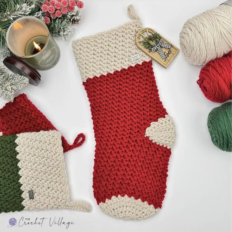 Solid Red crochet Christmas stocking with cream cuff, heel and toe, beside a red and green striped version
