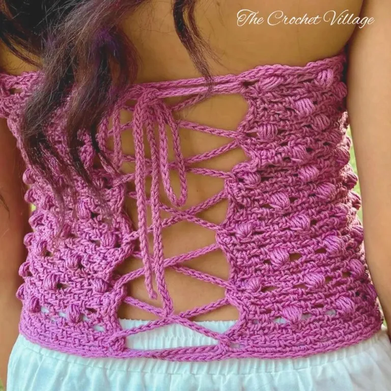 Back view of a young lady wearing a crochet strapless crop top with a crisscross back strap.Back view of a young lady wearing a crochet strapless crop top with a crisscross back strap.