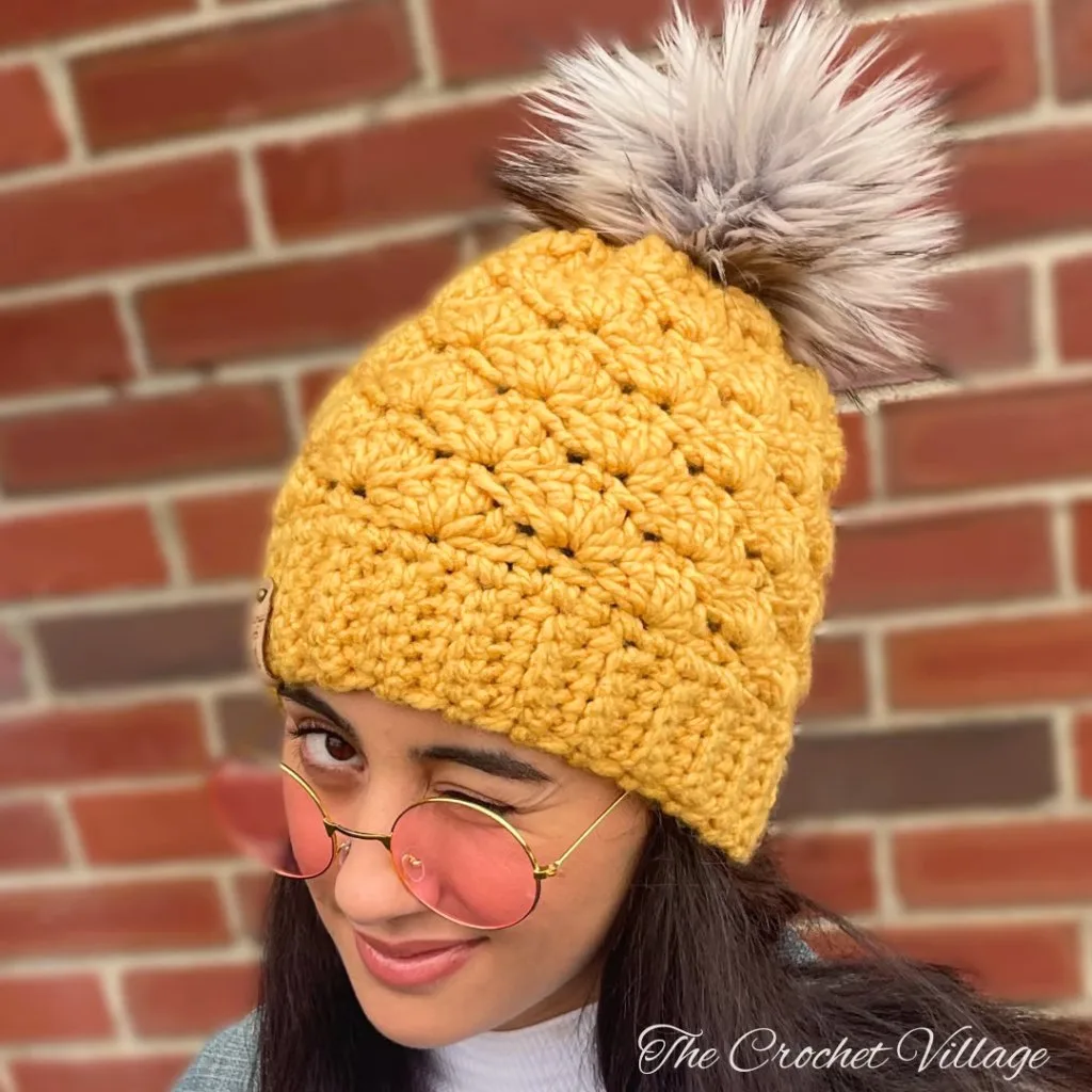 Young woman wearing the Dublin Hat, a free quick crochet chunky hat pattern that's easy to make