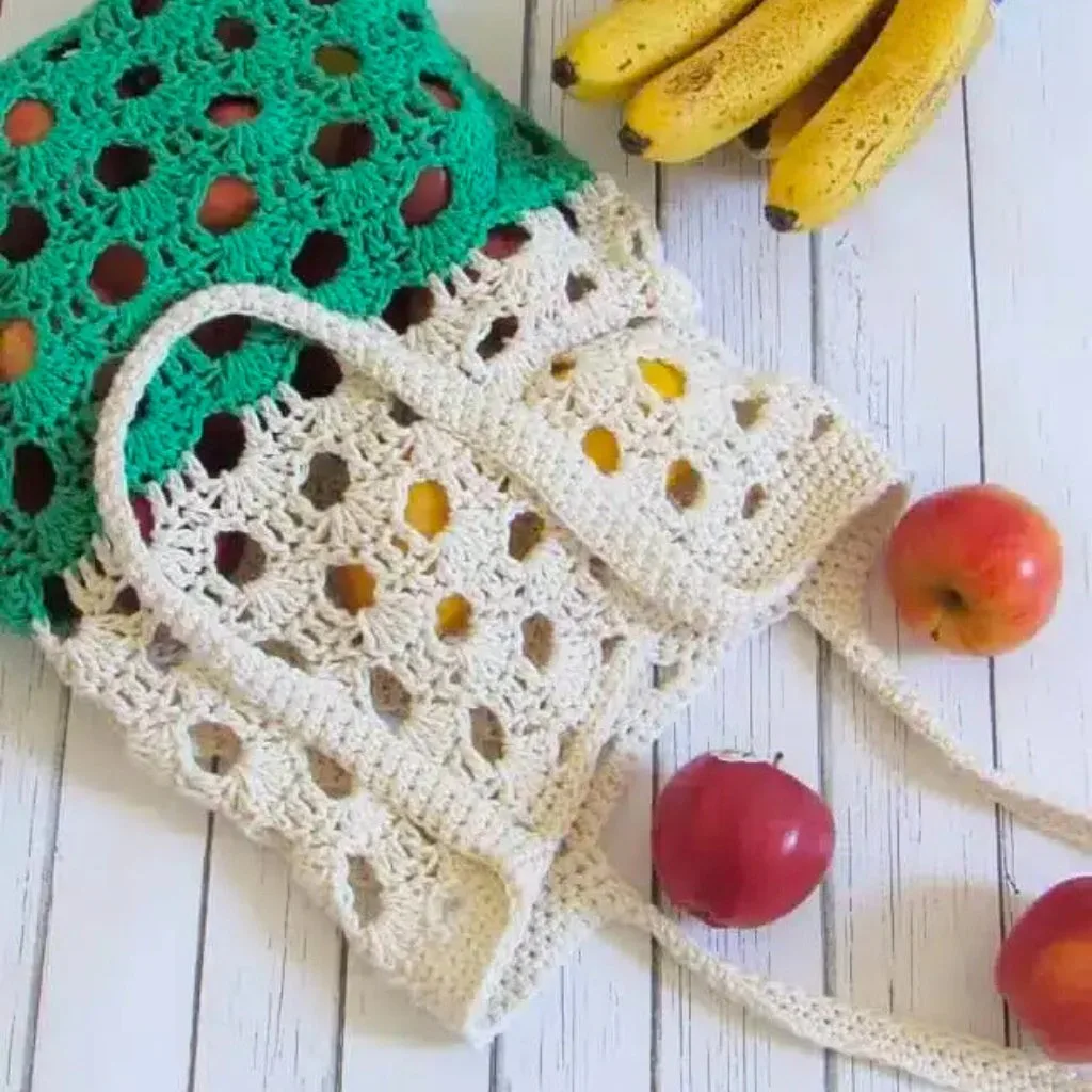 Crochet market tote bag filled with apples.