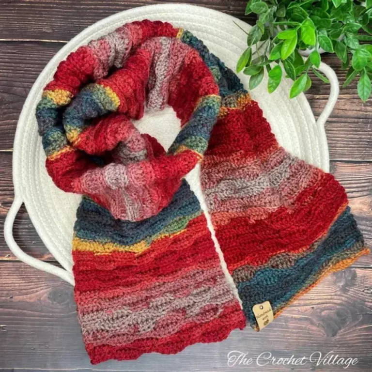 A lightweight boho crochet scarf elegantly displayed on a tray,