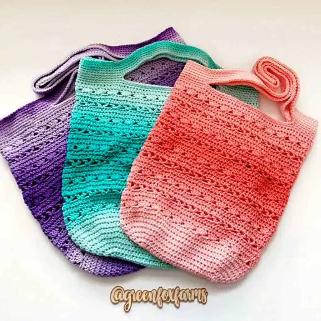 Three gorgeous crochet totes in different colors, perfect for the market.