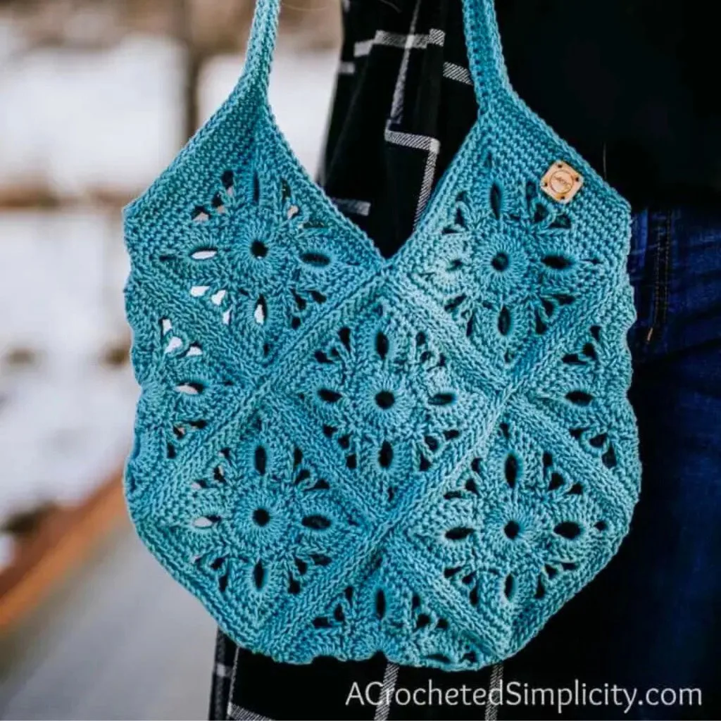A crochet summer bag featuring light and airy granny squares.