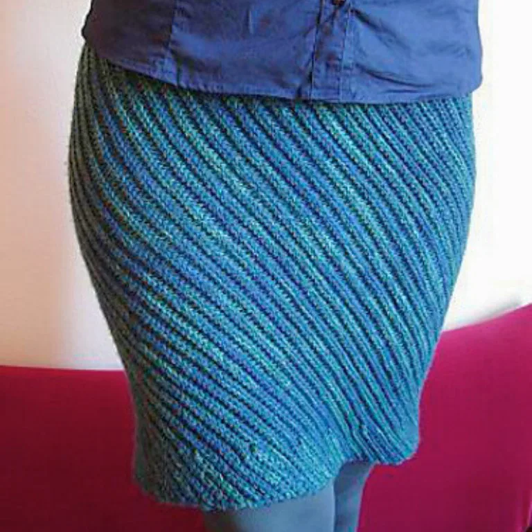 A woman wearing a formal crochet skirt, perfect for creating a custom mini, midi, or maxi skirt with a tailored fit and elegant design