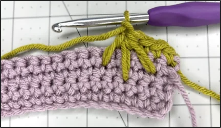 A close-up showing how to finish the spike stitch cluster
