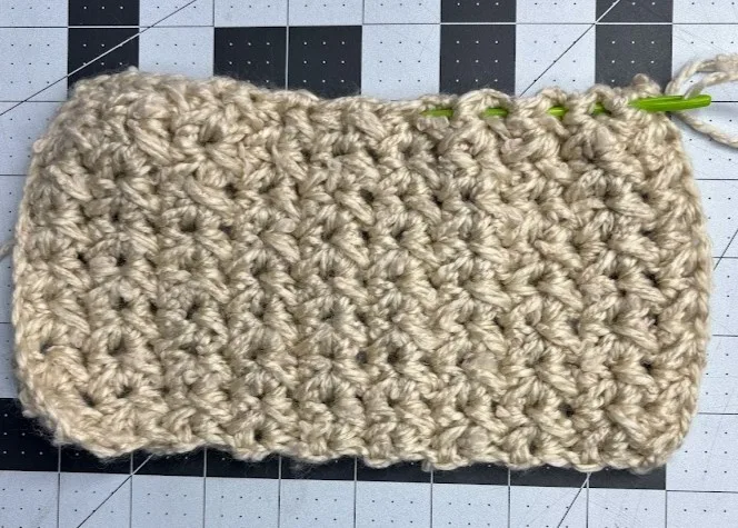 A crocheted rectangle piece, ready to be assembled into a bauble ornament."