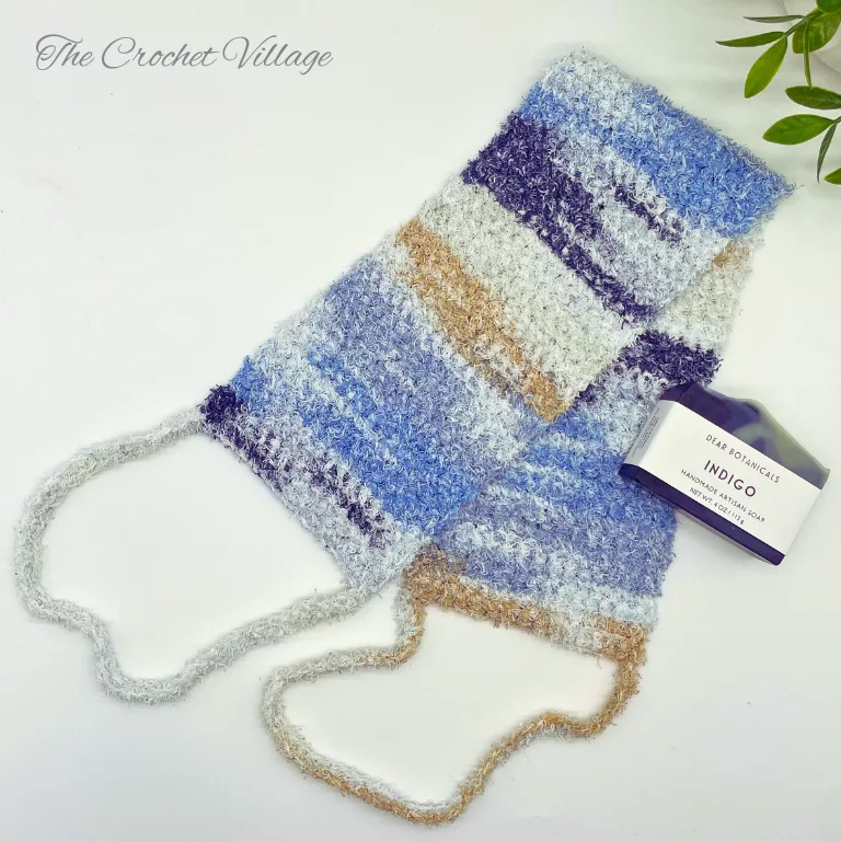 Handmade crochet back scrubber for him, shown with a bar of soap.