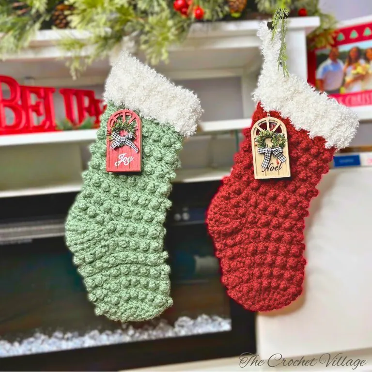 Handmade textured Christmas stockings with fur trim hanging by the fireplace