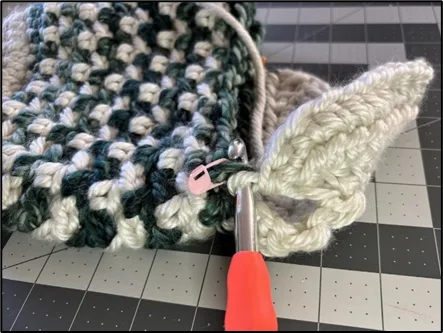 Progress photo demonstrating how the heel is shaped while crocheting the Large Crochet Christmas Stocking.