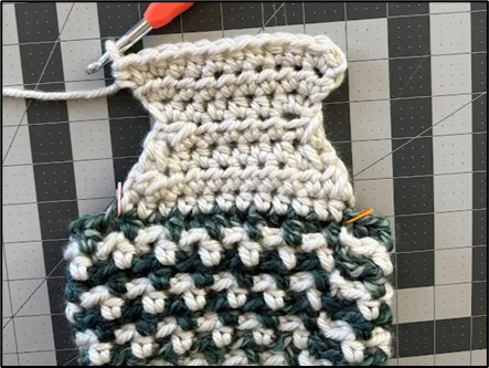 Progress photo showing the completed heel section of the Large Crochet Christmas Stocking before continuing with the foot.