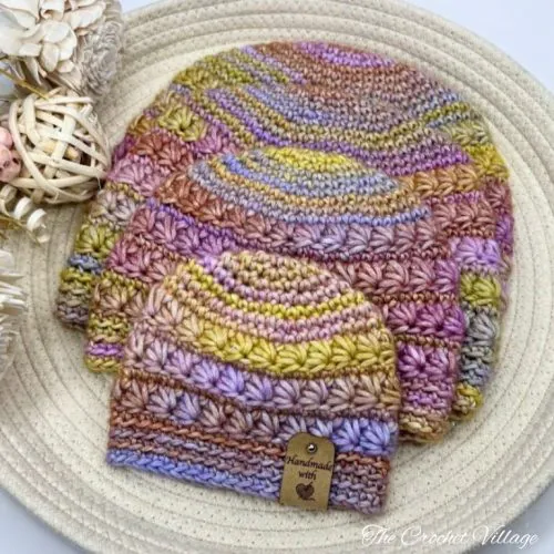 Crochet hat featuring star stitch, shown in multiple sizes.