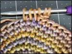 Star stitch crochet tutorial progress - demonstrating yarn placement and hook position