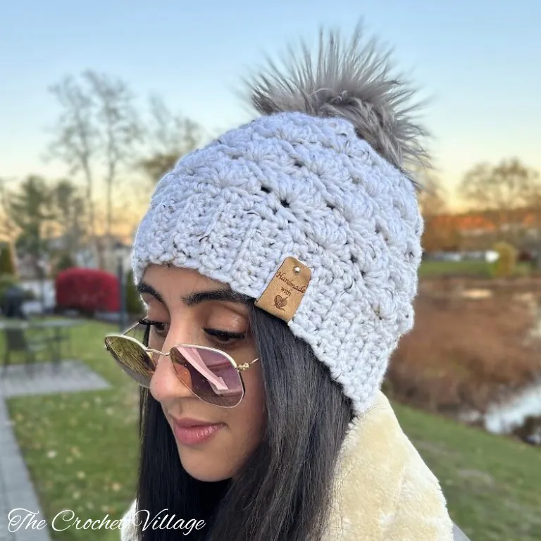Young woman wearing the Dublin Hat, a quick crochet chunky hat pattern
