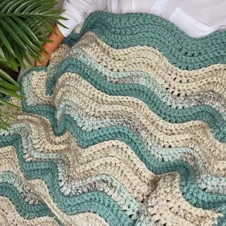 Crochet ripple blanket showing soft rolling wave peaks and valleys in teal and cream