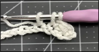 Close-up showing how to crochet tissue box cover stitch pattern step 2