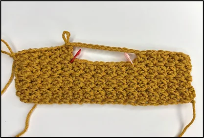 close up showing how to crochet the top opening of the box cover: step 2