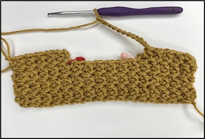 close up showing how to crochet the top opening of the box cover: step 1