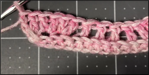 Close-up progress photo demonstrating how the ripple chevron stitch develops,