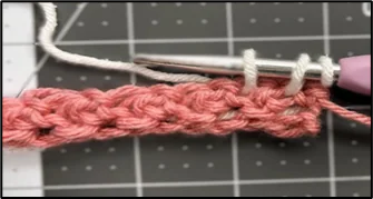 Close-up showing how to crochet tissue box holder stitch pattern row 2- step 1