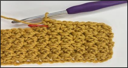 Progress image showing how to construct the top opening of crochet tissue box cover