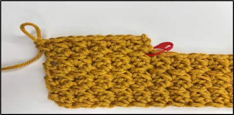 Progress image showing how to crochet the sides of the top opening of crochet tissue box cover