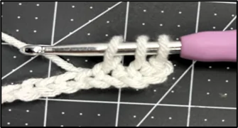 Close-up showing how to crochet tissue box holder stitch pattern step 1