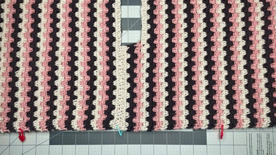 Arcadia crochet sweater showing simple two-panel construction with sleeves worked directly from panels