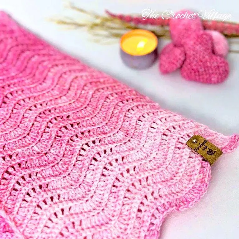 Detailed close up pink chevron crochet stitches showing beginner-friendly pattern technique