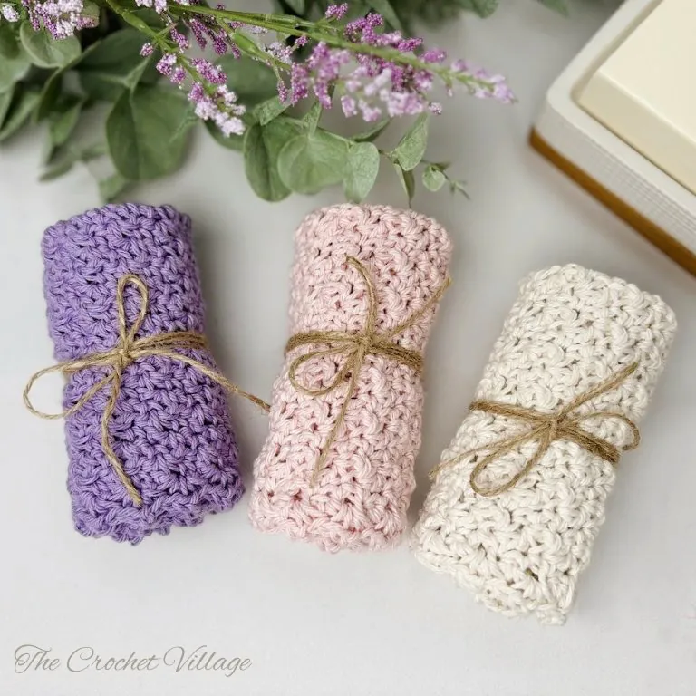 Beautiful handmade crochet dishcloth neatly wrapped and ready for gifting.