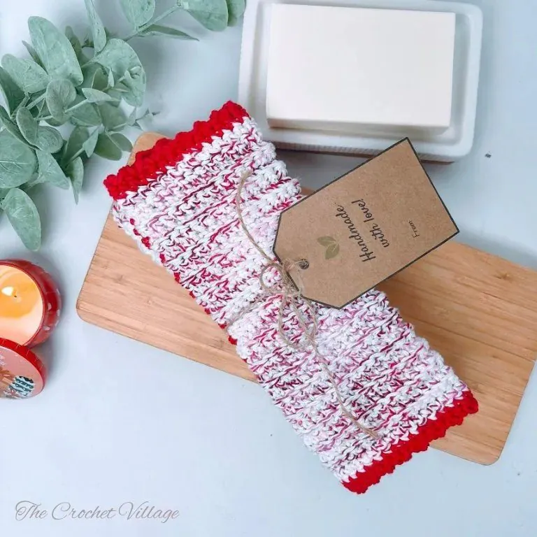 Crochet washcloth featuring red body with a fun contrasting pink border in a single crochet stitch pattern