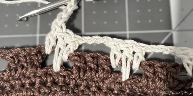 Crochet stitch close-up for crossbody messenger bag pattern showing stitch definition with mercerized cotton yarn