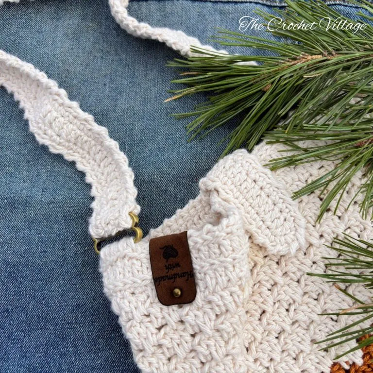 Close up of crochet closure flap detail on handmade Macchiato crossbody bag, cotton yarn texture