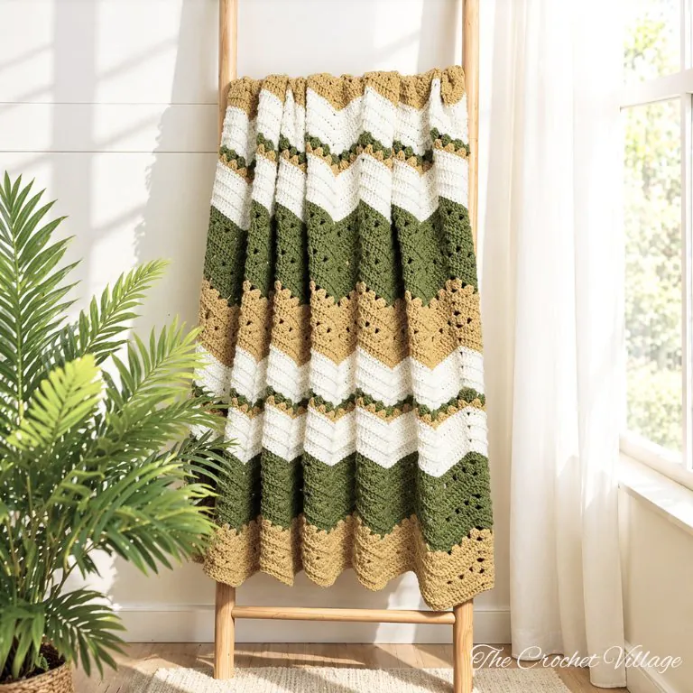 crochet ripple blanket hanging on wooden blanket ladder in olive green, mustard and cream tones