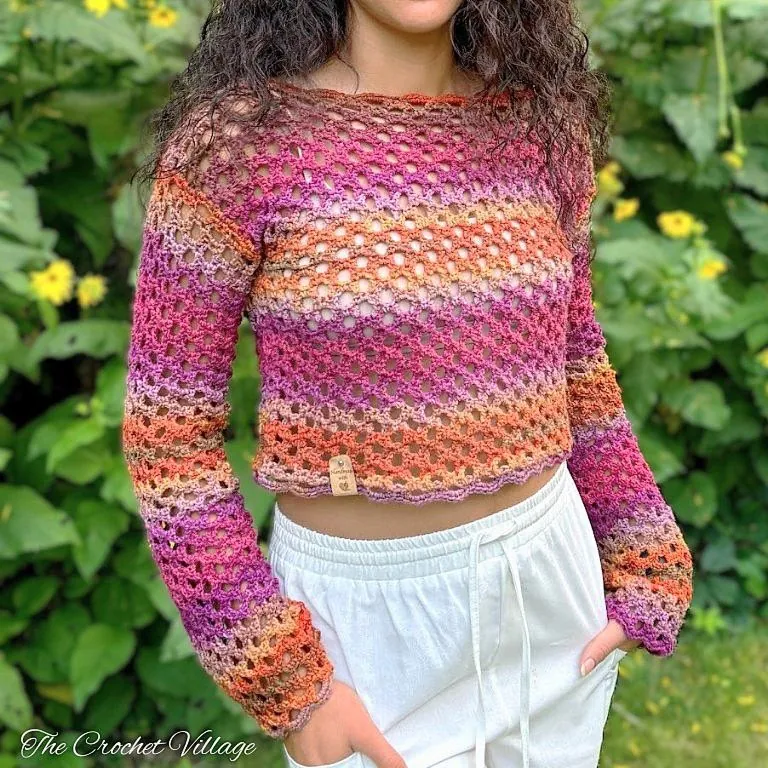 Crochet mesh sweater in soft pastel yarn worn by model, lightweight summer crochet top with relaxed fit