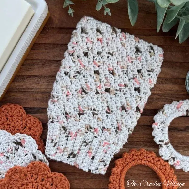 Textured crochet shower mitt in variegated papaya cotton yarn — free pattern from the Papaya Spa Set.