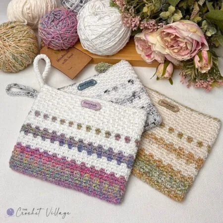 Three Milano free crochet clutch bags in different yarn colors — easy beginner small bag pattern using worsted weight cotton