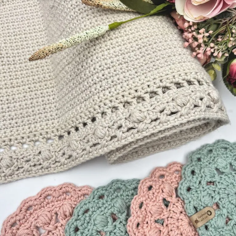 [photo] alt: Crochet table runner in soft cotton yarn, 15 by 73 inches, with a faux leather tag